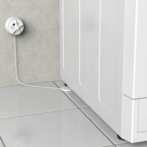 Vannstopper sensor installert på gulv ved vaskemaskin for lekkasjedeteksjon