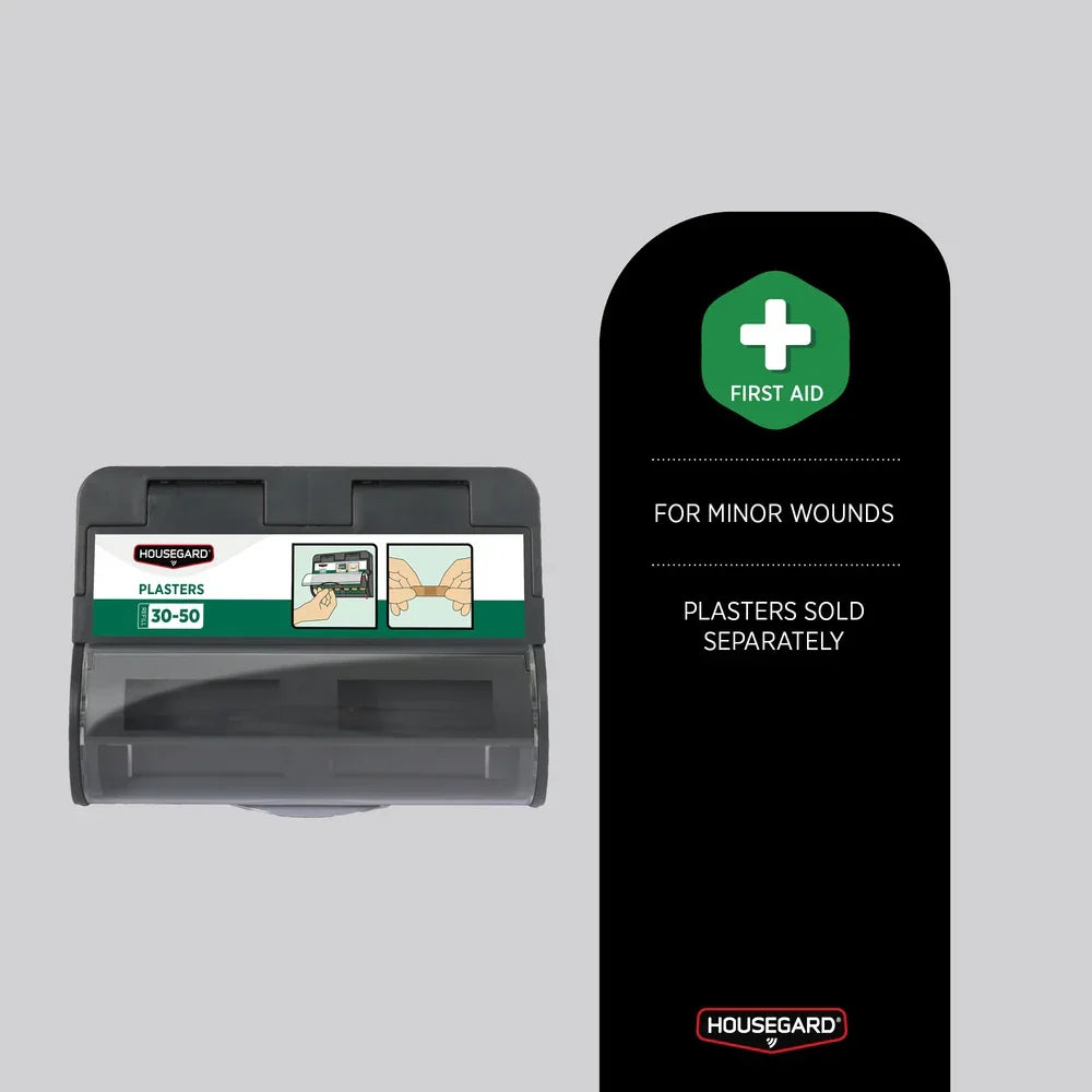 Vegghengt dispenser for plaster og små førstehjelpssår på grå bakgrunn