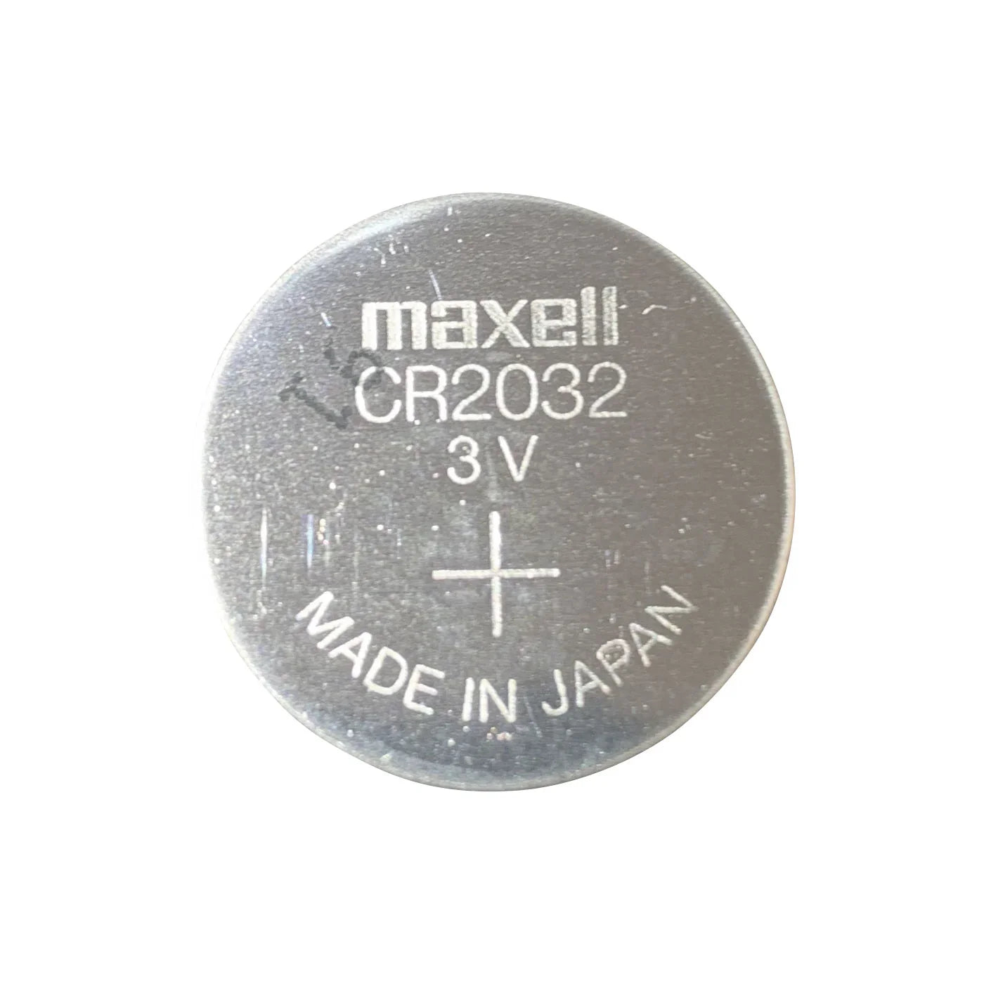 CR2032 knappcellebatteri 3V fra Maxell, sølvfarget, nærbilde med tekst.